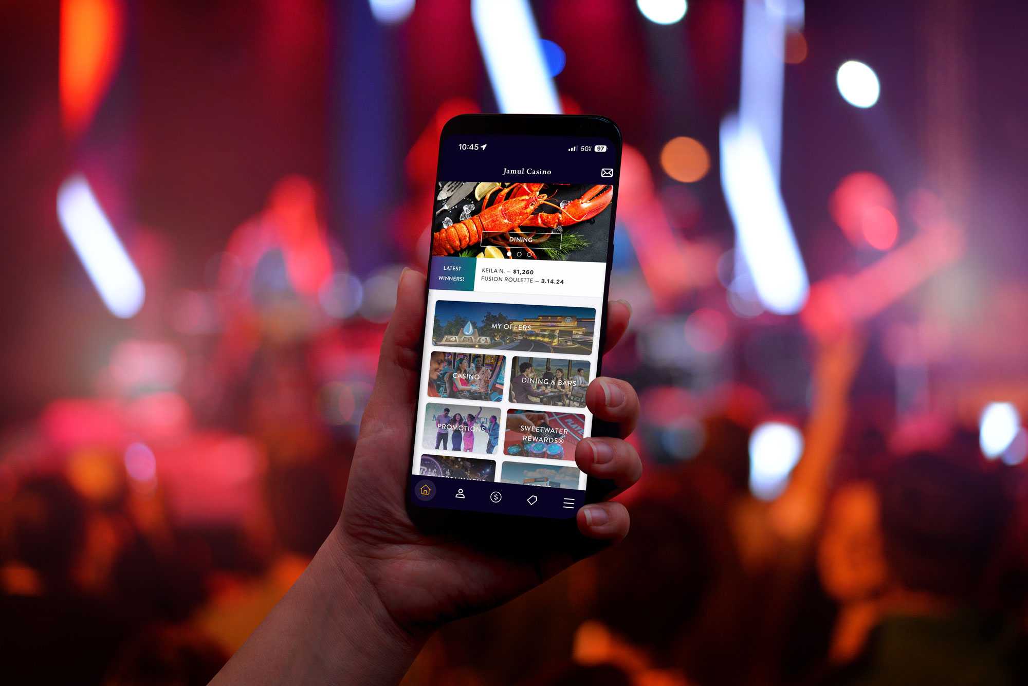 Jamul Casino app open on a phone at a concert.