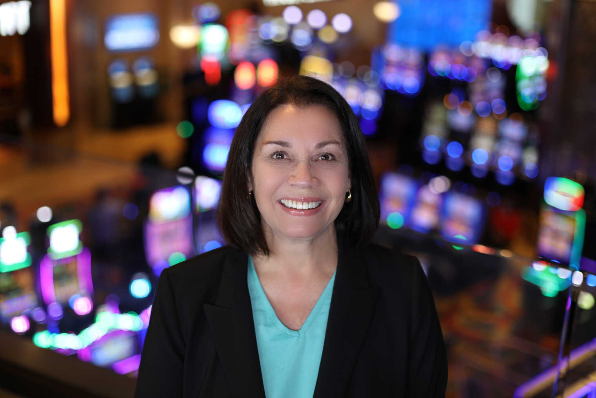 Theresa Grady, Chief Financial Officer (CFO) for Jamul Casino, standing in front of the vibrant casino floor.