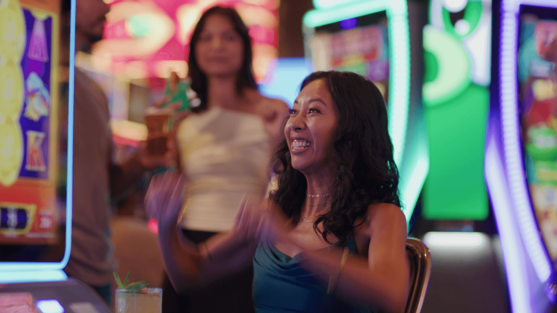 Two women celebrating a slot machine win at Jamul Casino Resort