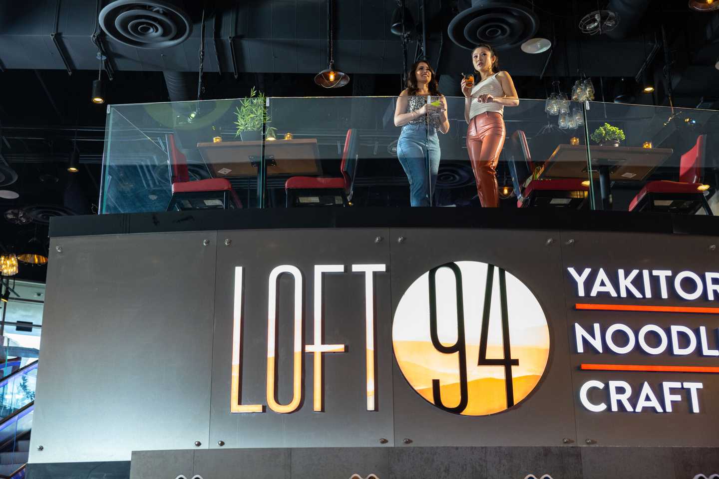 Two women hang out at Loft 94.