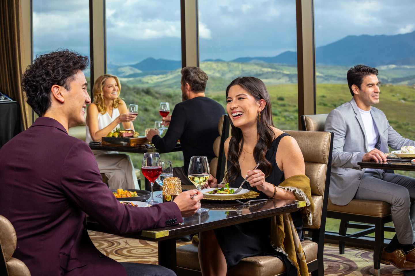 An elegant couple is having a high-end dinner at Prime Cut Steakhouse & Seafood.