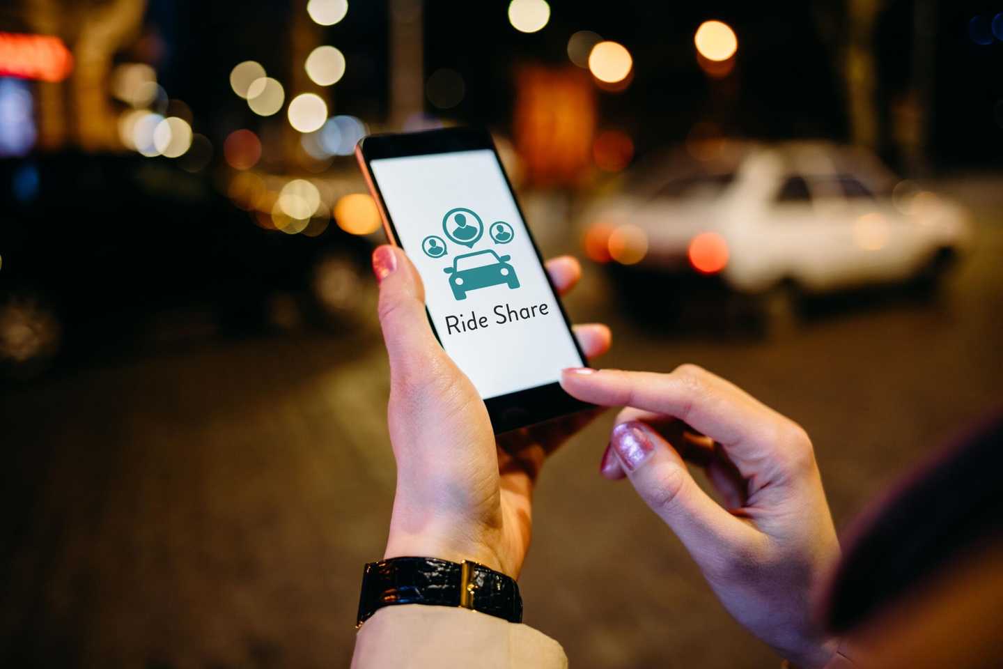 A person is looking through a ride share app