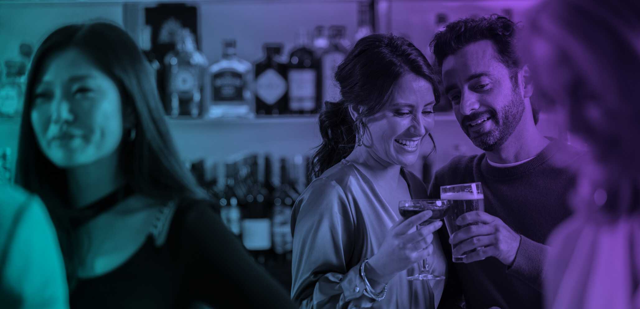 Young people enjoying a drink in a lively bar.